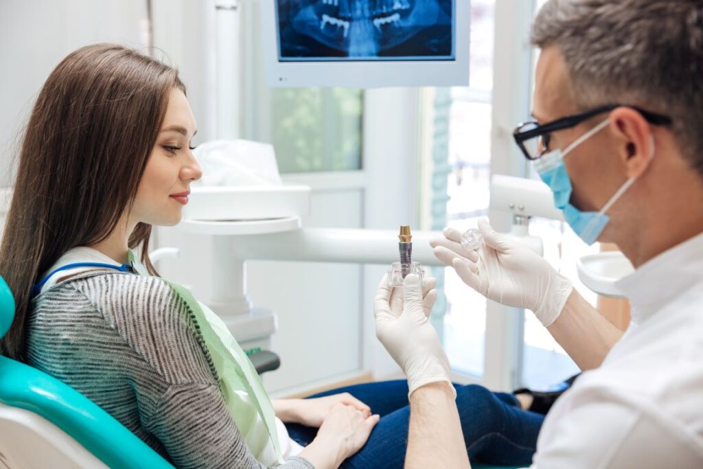 A dentist discussing the benefits of dental implants with a patient.